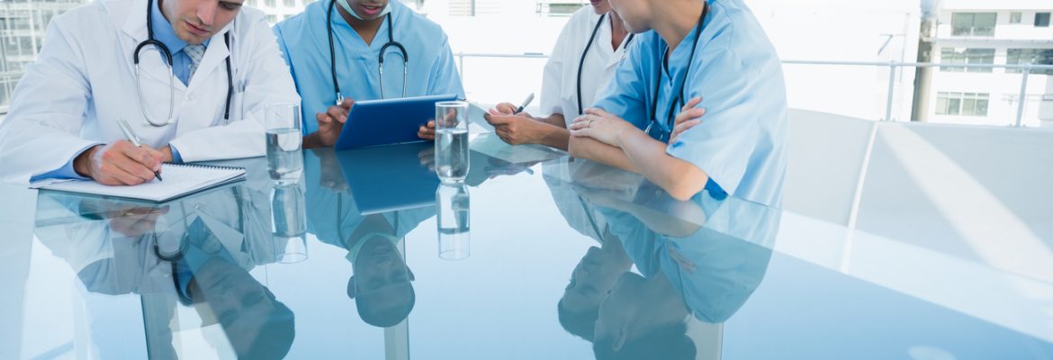 Marketing Tips: Group of young doctors in a meeting at hospital.