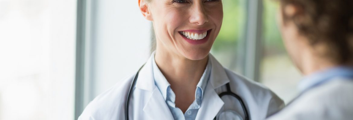 Beautiful doctor discussing with colleague in a promotional video.