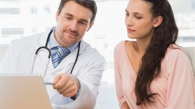 Doctor shows patient how sites like ZocDoc can prompt for patient reviews.